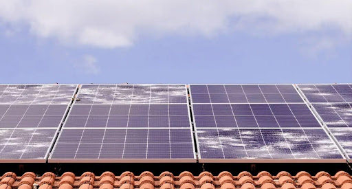 Hail damage to solar panels typically manifests as cracked or shattered glass, dented frames, or impaired functionality, resulting from the high-velocity impact of hailstones during severe weather conditions.